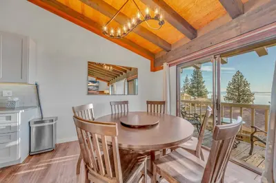 a kitchen and dining room with a table and chairs at Lake Tahoe Vacation Rental Fireplace and Balcony in Incline Village