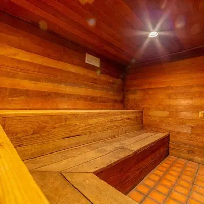 a sauna with wooden walls and a wooden floor at Plush Mammoth Condo w Balcony Views in Mammoth Lakes