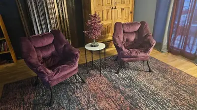 two chairs and a table in a living room at The Secret Hideaway in Oakhurst
