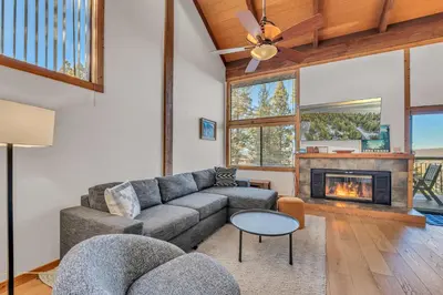 a living room with a couch and a fireplace at Cozy Mountain Retreat in Truckee Near Northstar in Truckee