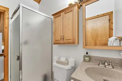 a bathroom with a toilet and a sink and a shower at Cozy Mountain Retreat in Truckee Near Northstar in Truckee