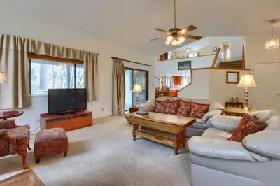 a living room with a couch and a tv at Cabin Among the Firs in Wawona