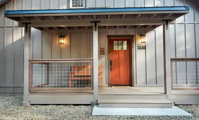 a garage with a red door on a building at Hilltop Haven in Wawona