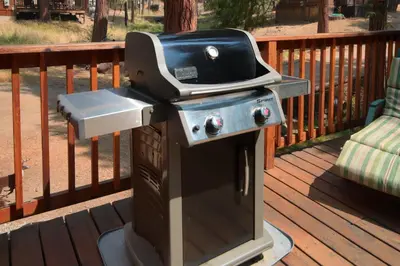 a grill sitting on top of a deck at Chipmunks Holiday in Wawona