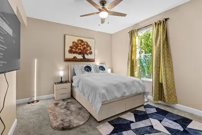 a bedroom with a bed and a ceiling fan at Game Lovers Retreat, spacious 4000 sqft Getaway in El Dorado Hills