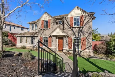 a house with a gate in front of it at Game Lovers Retreat, spacious 4000 sqft Getaway in El Dorado Hills