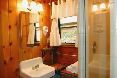 a bathroom with a sink and a shower at Cubby's Den in Wawona
