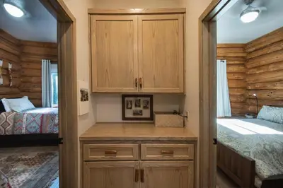 a small bedroom with a bed and a closet at The Mini Cabin in Wawona