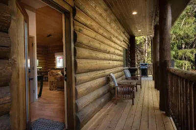 a wooden wall on a porch of a house at The Mini Cabin in Wawona