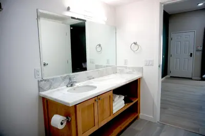 a bathroom with a sink and a mirror at The Palisades Lodge of Big Pine in Big Pine