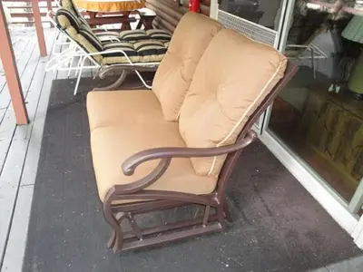 a bench sitting outside of a store window at River Song in Wawona