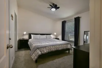 a bedroom with a bed and a ceiling fan at Suter's Forte in Wawona