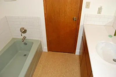 a bathroom with a tub and a sink at Mountain Retreat in Wawona