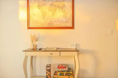 a table with a map on the wall next to a table with cookies at Hillside Sky Ranch Retreat 12 miles from Yosemite in Oakhurst