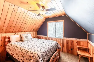 a bedroom with a bed and a ceiling fan at Grant's Camp in Wawona