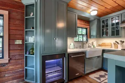 a kitchen with gray cabinets and an oven at The Overlook in Wawona