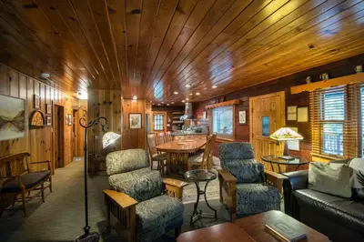 a living room with a couch and chairs and a table at Sugar Pine Suite in Wawona