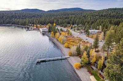 an aerial view of a body of water with a pier at Aqua Vista Lakefront Estate by Tahoe Getaways - 6 BR in Carnelian Bay w Buoy, Pier & Game Room in Carnelian Bay