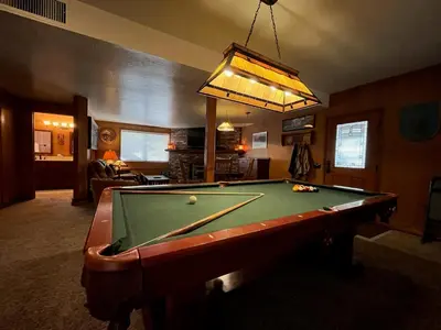 a living room with a pool table in a room at The Tree House II in Wawona