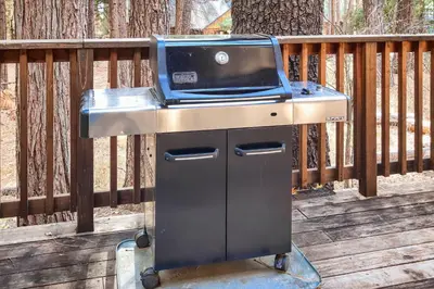 a grill sitting on top of a wooden deck at Spindler's Chalet in Wawona