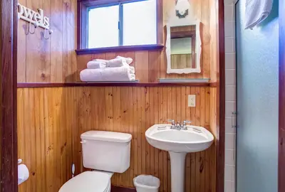 a bathroom with a toilet and a sink at Soots-Me in Wawona