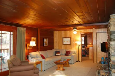 a living room with a couch and a table at Squirrel's Nest in Wawona