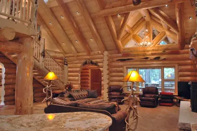 a living room in a log cabin at El Capitan in Wawona