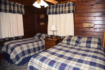 a bedroom with two beds in a cabin at Sequoia in Wawona