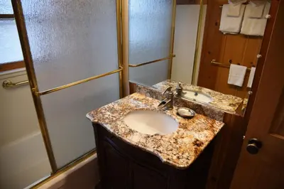 a bathroom with a sink and a shower at Half Dome in Wawona