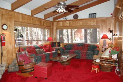 a living room with a couch and a table at Shehadey's Retreat in Wawona