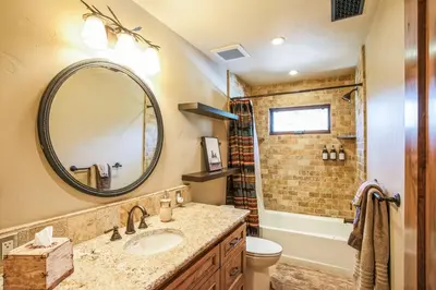a bathroom with a sink and a mirror at 4BR Cabin with Hot Tub – Ultimate Truckee Escape cabin in Truckee