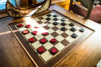 a chess board on a table with roses on it at Handcrafted Tahoe Retreat Walk to Beach & Ski in Tahoe City