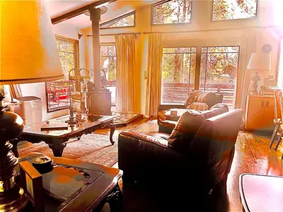 a living room with a couch and a table at ManVee at Yosemite in Fish Camp