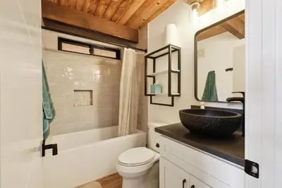 a bathroom with a sink and a toilet at Golden Peak Cabin home in Groveland