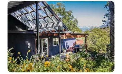 a small house with a glass roof on top of it at Alta Peak House in Three Rivers