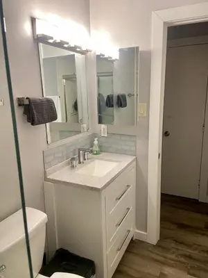 a bathroom with a sink and a toilet and a mirror at North Tahoe Escape in Incline Village