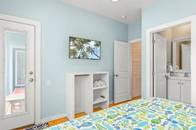 a bedroom with a bed and a fireplace at Why Knot Relax - Heated PRIVATE Pool Beach Gear Credit Included in Fresno