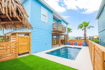 a house with a swimming pool next to a house at Why Knot Relax - Heated PRIVATE Pool Beach Gear Credit Included in Fresno