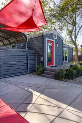 a tiny house with a red door at Charming Home, near beautiful park and tennis courts! in Roseville