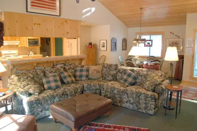 a living room with a couch and a table at Doyle's Mountain in Wawona