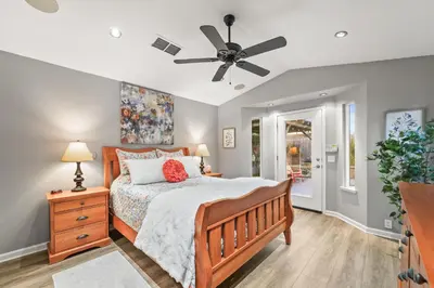 a bedroom with a bed and a ceiling fan at Casita Andrade in Turlock