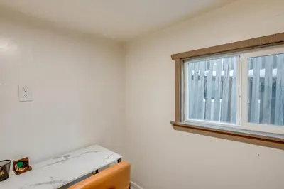 a kitchen with a window and a white wall at Walk to Beach Dog-Friendly Cabin in Glenbrook! in Glenbrook