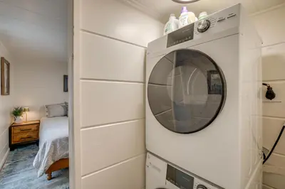 a washing machine hanging on a wall in a room at Walk to Beach Dog-Friendly Cabin in Glenbrook! in Glenbrook