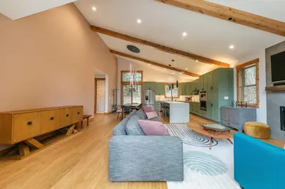 a living room with a couch and a table at Radiant Retreat by Tahoe Getaways - 4 BR in Tahoe Donner with Hot Tub & HOA in Truckee