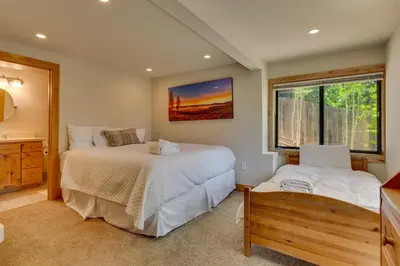 a bedroom with two beds and a window at Hyphen 3-bedrooms rental, private beach, filtered view in Tahoe City