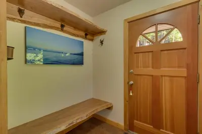 a hallway with a wooden door and a window at Hyphen 3-bedrooms rental, private beach, filtered view in Tahoe City