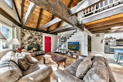 a large living room with a couch and a tv at Bear Chalet - Snow Play - 4 Bedrooms - Foosball in South Lake Tahoe