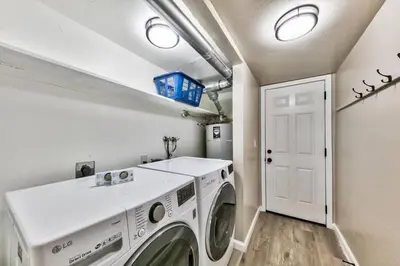 a laundry room with a washer and dryer at Bear Chalet - Snow Play - 4 Bedrooms - Foosball in South Lake Tahoe