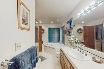 a bathroom with a sink and a tub at Bearfoot Getaway in Shaver Lake