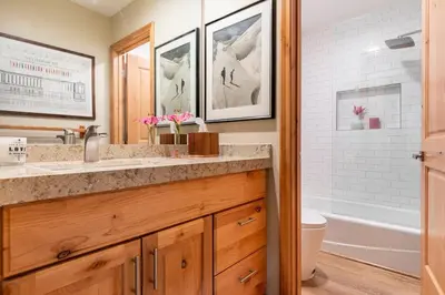 a bathroom with a sink and a toilet and a tub at Scenic Views Hot Tub Ski Shuttle Pet Friendly in Mammoth Lakes